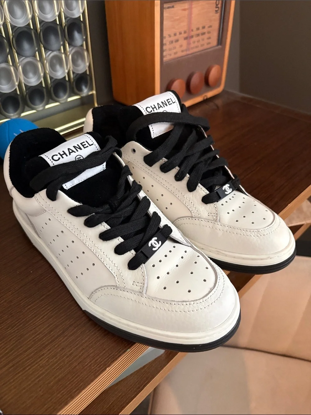 CHANEL White Leather Sneakers with Black Accents